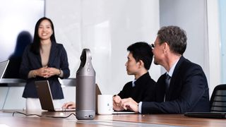 Executives hold a conference using one of the best conference room webcams