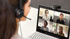 Jabra PanaCast 20 webcam in use by woman conducting a video meeting with work colleagues 