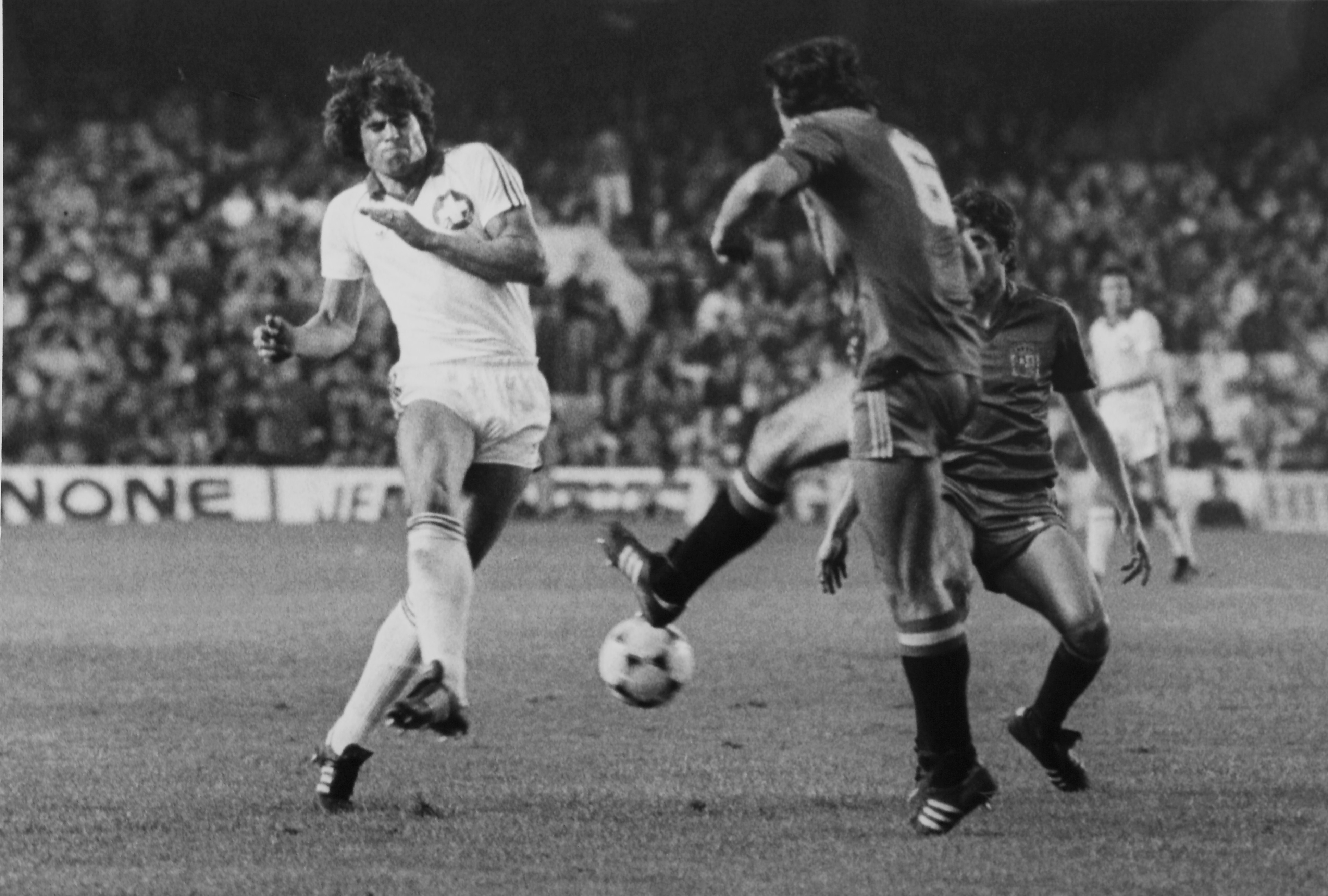 Spain Jose Ramon Alexanko clears the ball from Switzerland's Andy Egli in an international match in 1982.