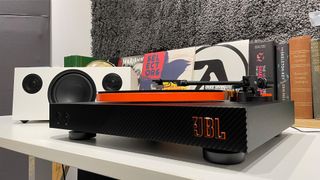 JBL Spinner BT turntable from front/side angle showing JBL logo