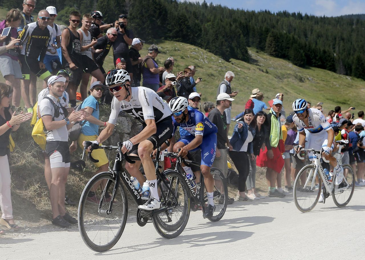 Chris Froome (Team Sky) chases back after a puncture on stage 10