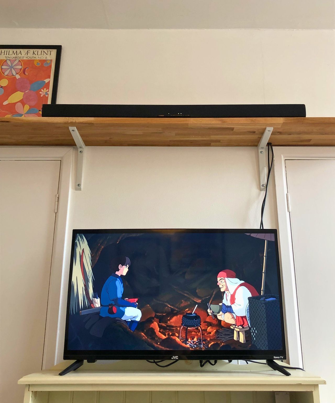 Yamaha True X Bar 40A soundbar on wooden shelf above TV playing Princess Mononoke in Dan Fauzi's home.