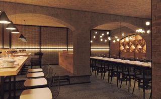 Canard and Champagne cellar with exposed brick arches and long wooden dining tables