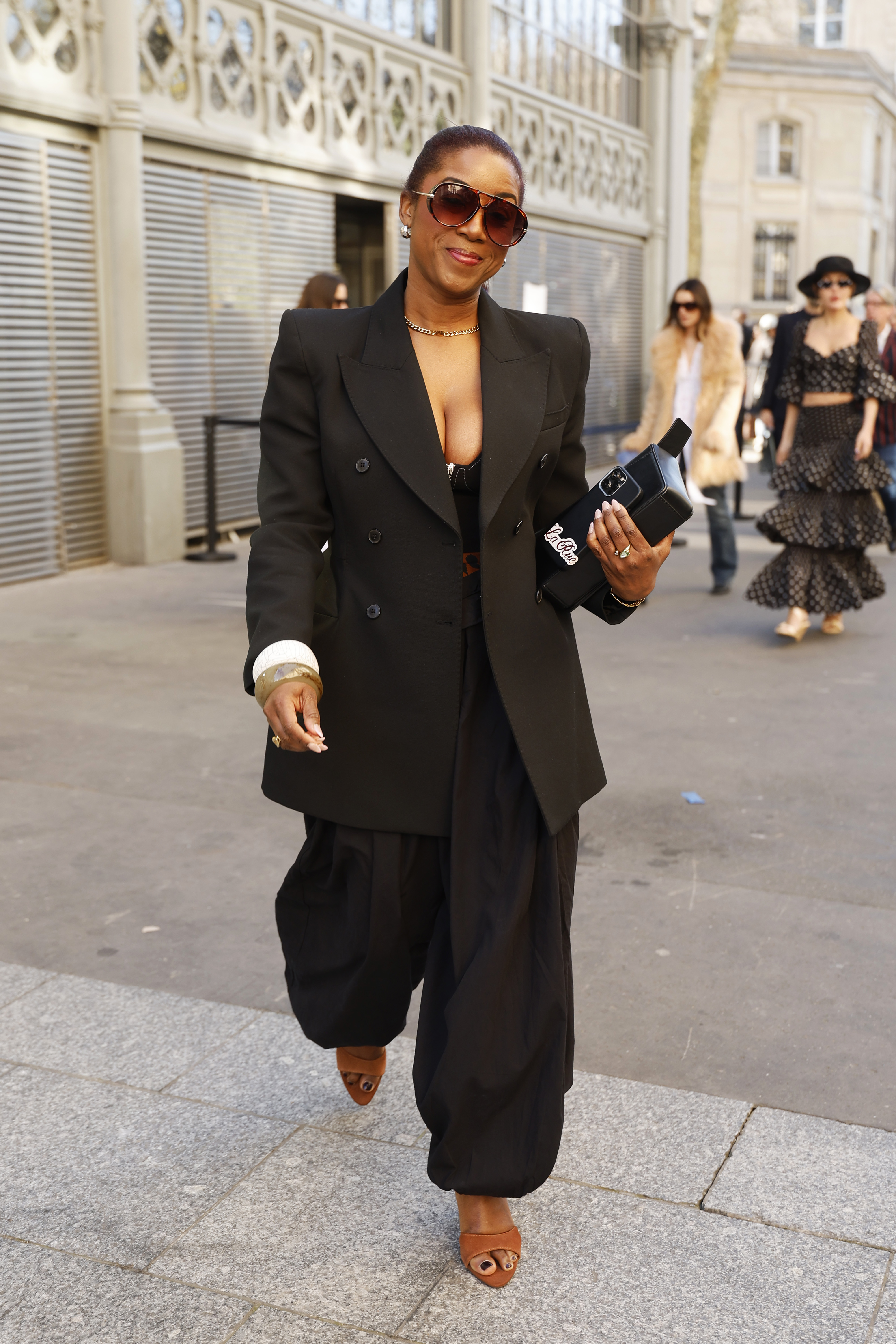 Woman in balloon pants and a blazer