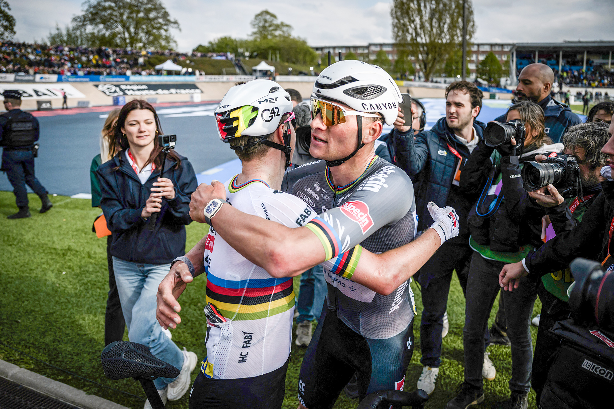 Second placed UAE Team Emirates&#039; Slovenian rider Tadej Pogacar (L) and first placed Alpecin-Deceuninck&#039;s Dutch rider Mathieu van der Poel celebrate after the 122nd edition of the Paris-Roubaix one-day classic cycling race, 259,2 km between Compiegne and Roubaix, northern France on April 13, 2025. (Photo by JEFF PACHOUD / AFP) (Photo by JEFF PACHOUD/AFP via Getty Images)