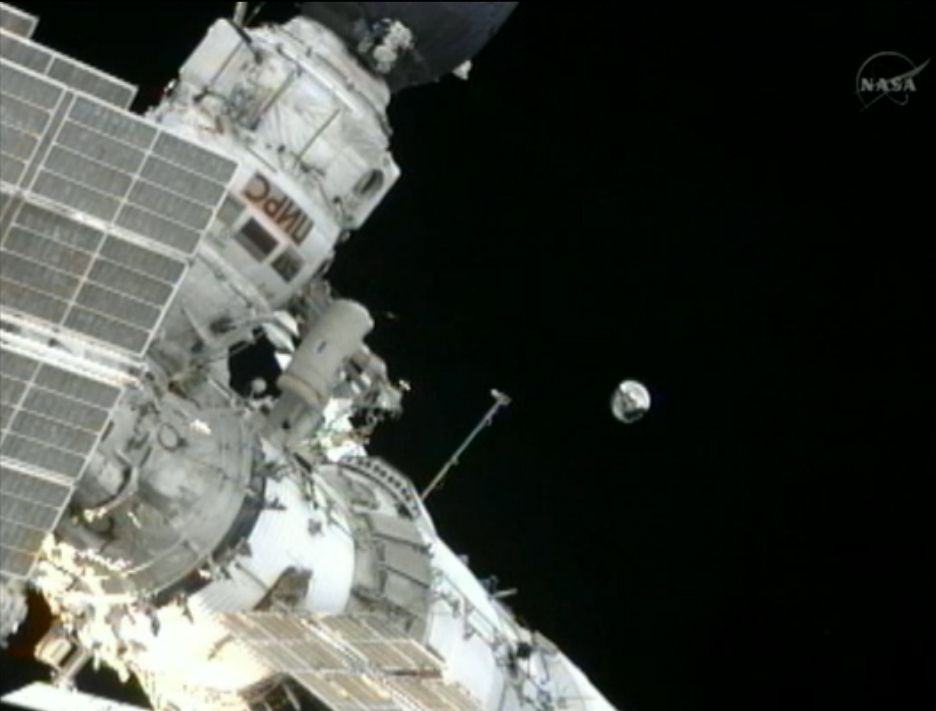 Spacewalking Cosmonauts Toss Satellite Overboard Space