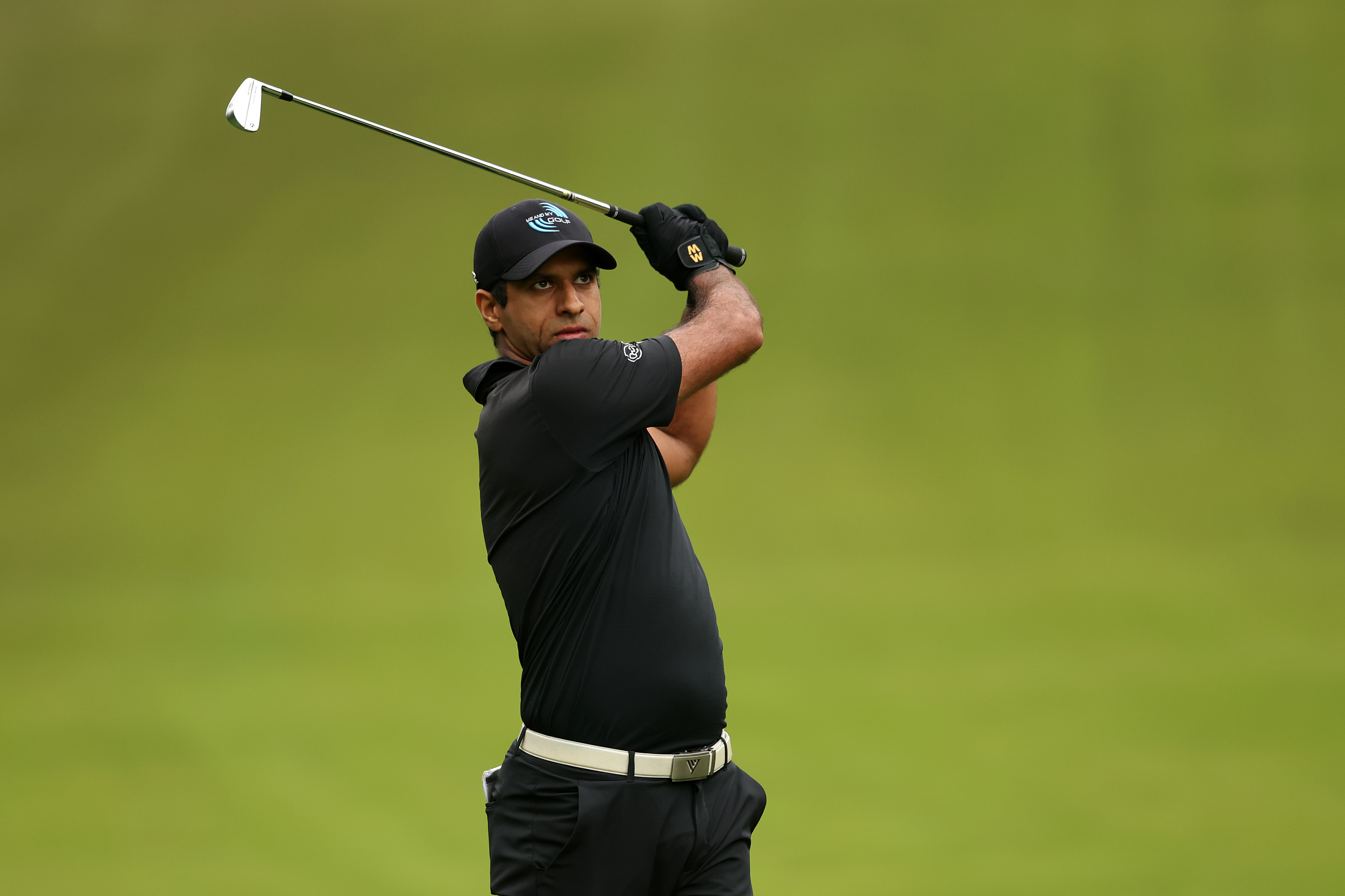 Aaron Rai hits an iron shot