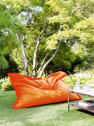 outdoor living room with large orange bean bag