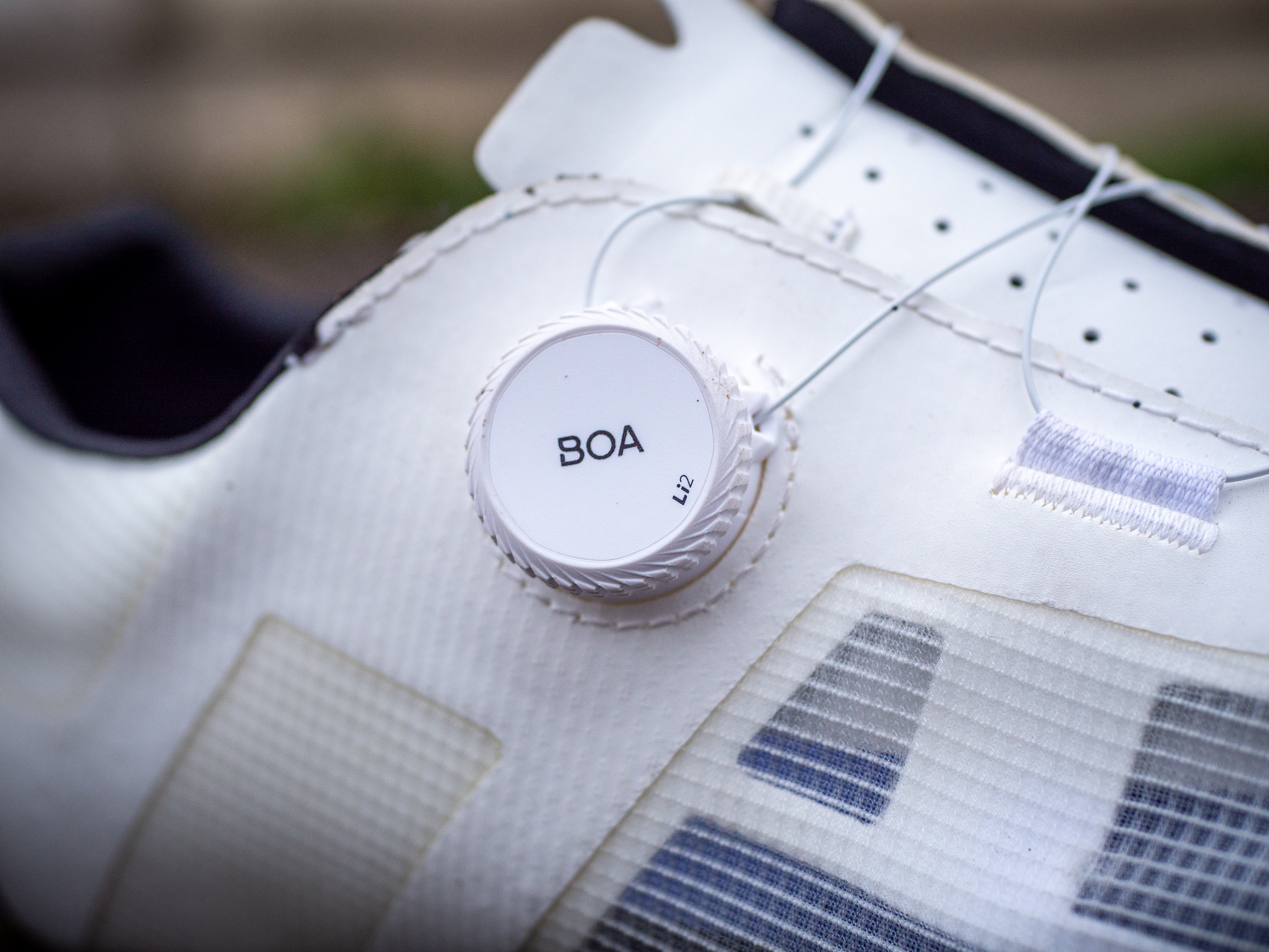 A white pair of Fizik Vento Proxy gravel shoes