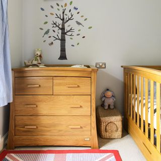 kids room with printed white wall and wooden cabin bed