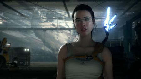 margaret qualley as mama standing in a white tank top in a dark laboratory