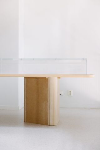 An empty glass vitrine next to white wall