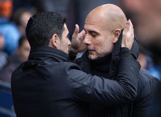 Mikel Arteta and Pep Guardiola greet each other ahead of a Premier League game between Manchester City and Arsenal at the Etihad Stadium in March 2024.