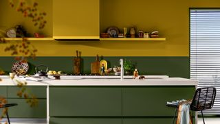 Kitchen with green kitchen cabinets and yellow walls to show the Dulux Colour of the year 2025