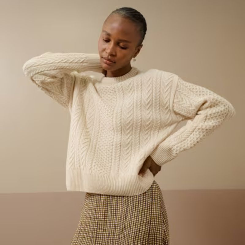 white cable knit wool sweater