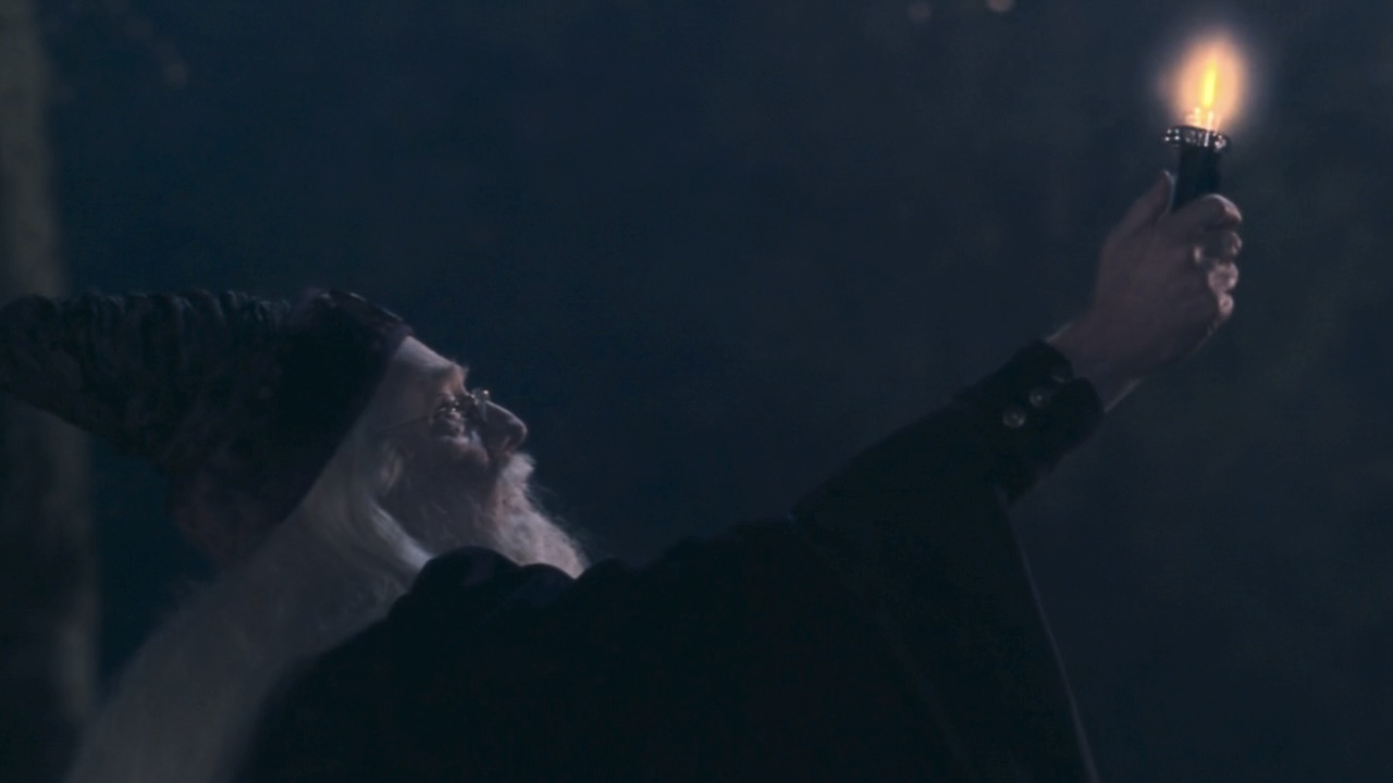 Dumbledore with a deluminator in Harry Potter and the Sorcerer's Stone