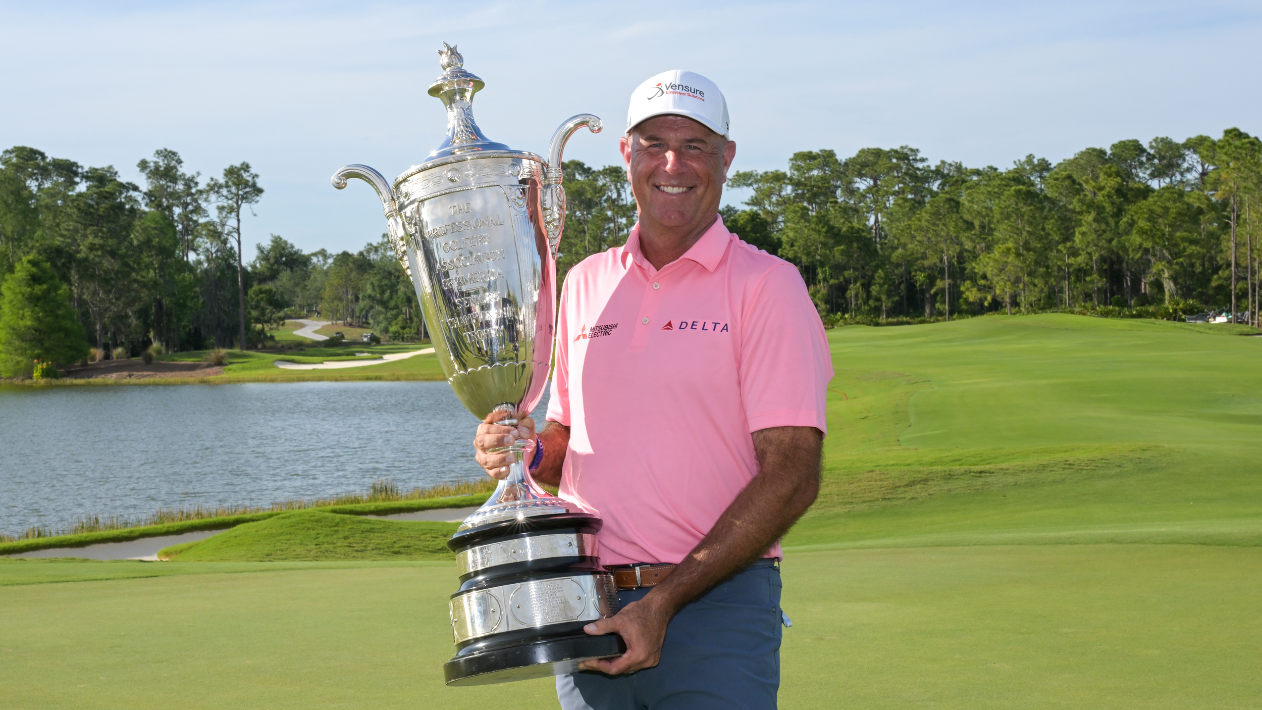 Stewart Cink holds the Senior PGA Championship trophy