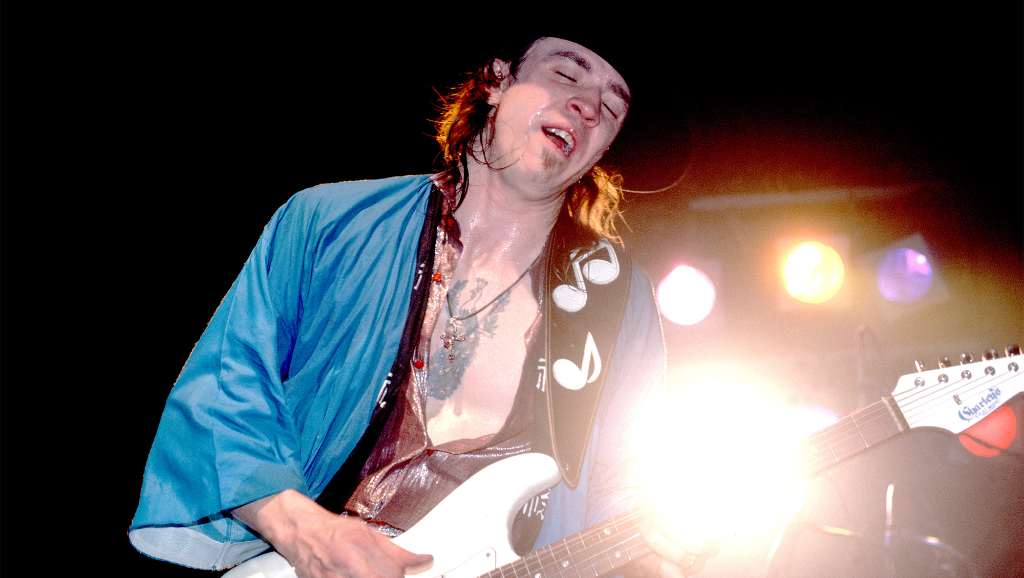 Stevie Ray Vaughan plays guitar as he performs onstage at the Fireside Bowl, Chicago, Illinois, February 17, 1984.