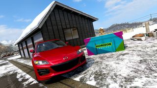 Forza Horizon 6 hokubu winter treasure hunt red car posing next to treasure chest in the snow