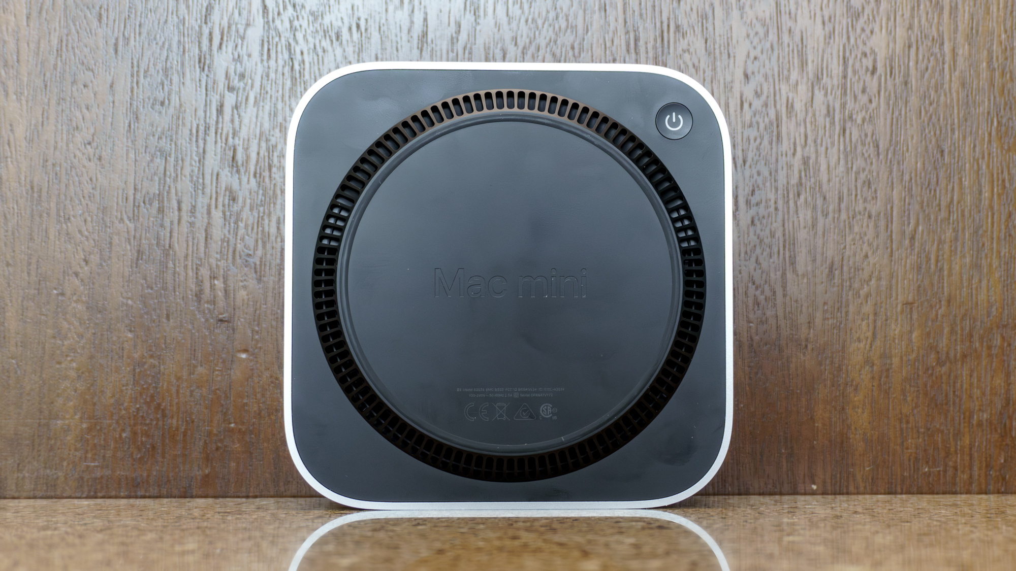 The underside and power button of the Mac Mini with M6