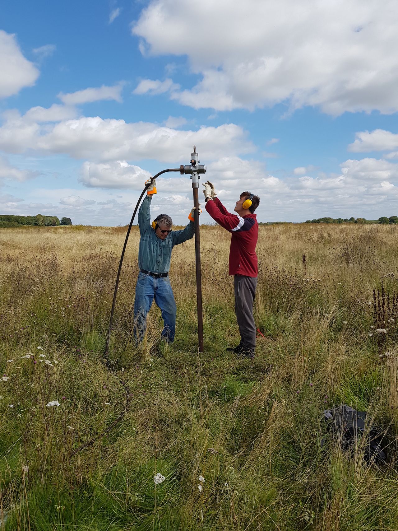 Archaeologists take sediment samples from the roughly 4,500-year-old pits.