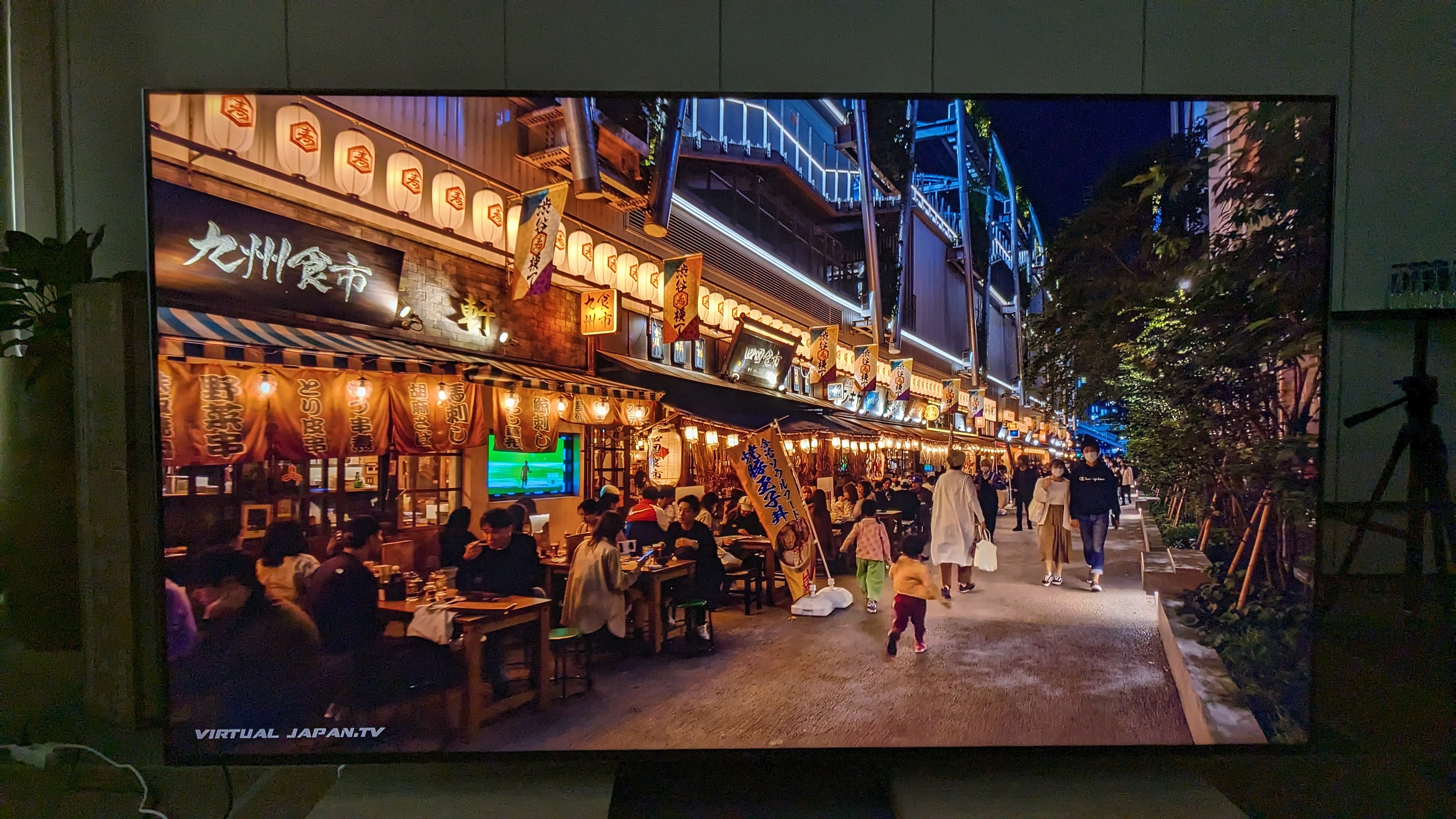 TCL C845 with YouTube video of tokyo on screen