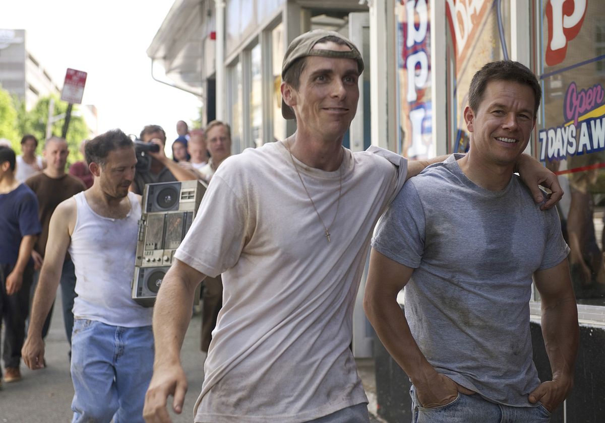 Christian Bale and Mark Wahlberg walk down a street together