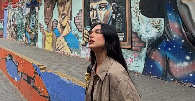 Dua Lipa Just Made The Fanciest Dress Casual in .5 Seconds With *This* Outerwear Trend