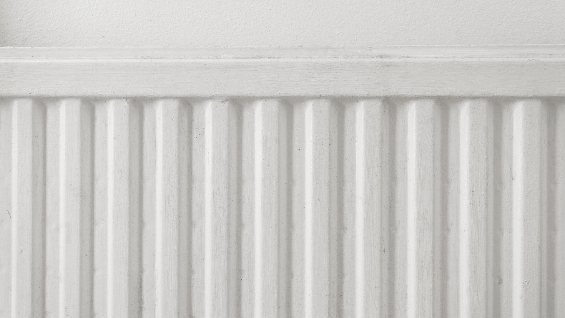 picture of white radiator with dirty marks on it
