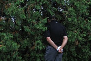 Retief Goosen looking in a bush