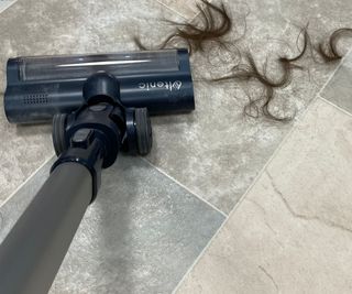 Ultenic FS1 vacuuming hair up off linoleum floor