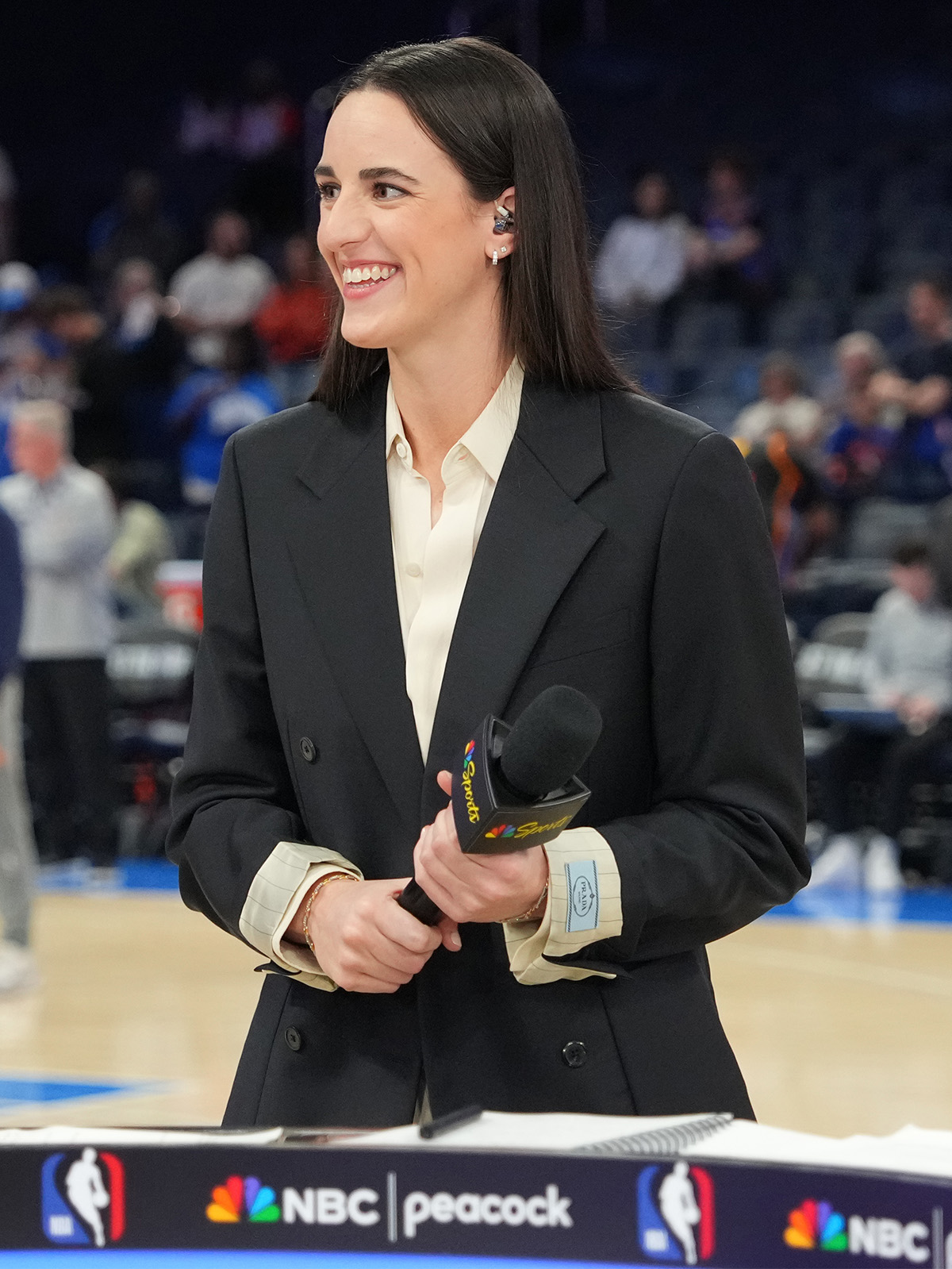 OKLAHOMA CITY, OK - MARCH 29: Caitlin Clark smiles before the game between the New York Knicks and the Oklahoma City Thunder on March 29, 2026 at Paycom Center in Oklahoma City, Oklahoma. NOTE TO USER: User expressly acknowledges and agrees that, by downloading and or using this photograph, User is consenting to the terms and conditions of the Getty Images License Agreement. Mandatory Copyright Notice: Copyright 2026 NBAE