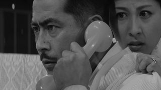 A wealthy executive listens on the phone and learns his son is kidnapped in High and Low