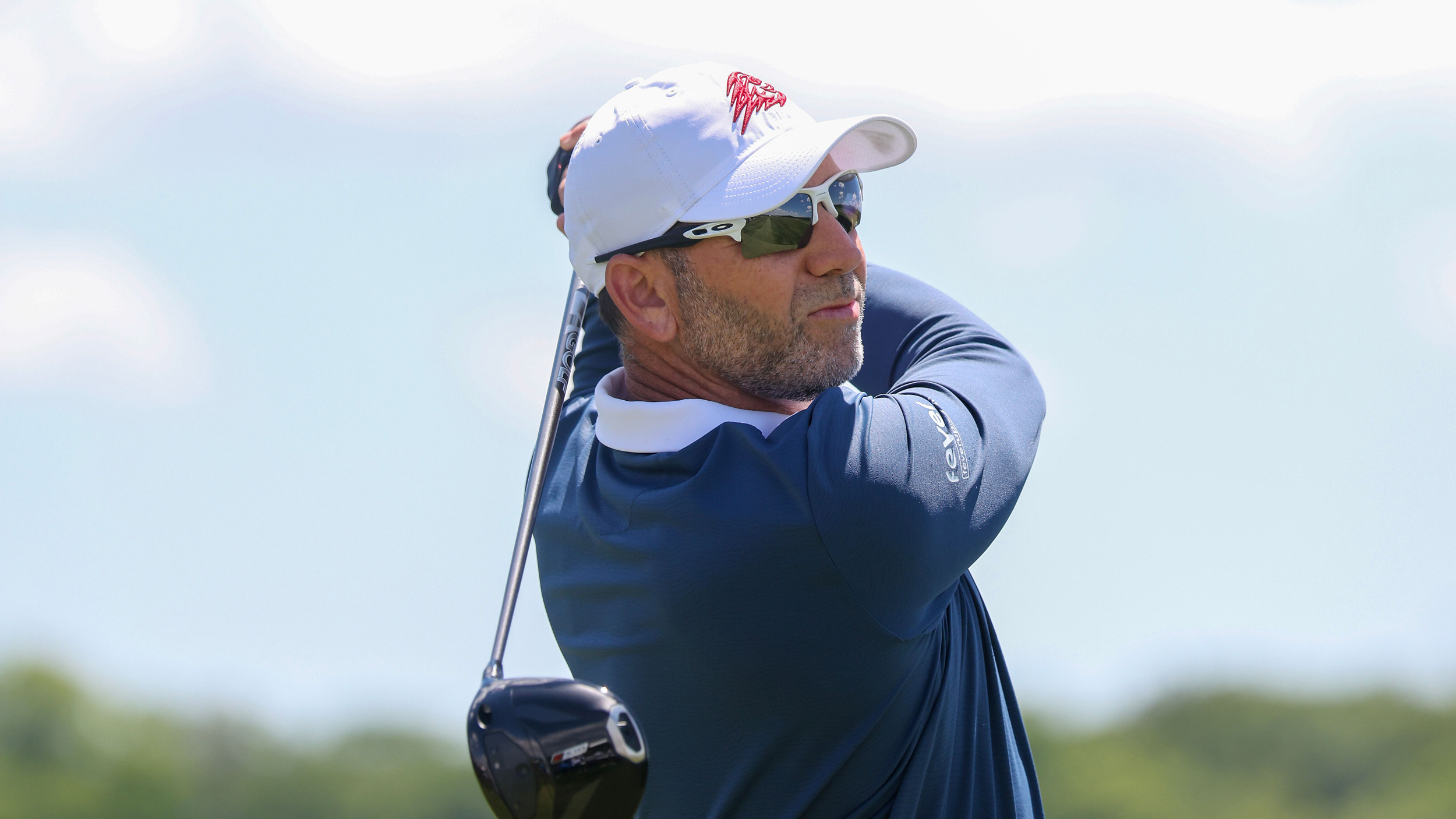 Sergio Garcia holds his finish on a drive