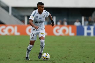 Angelo of Santos runs with the ball during the match between Santos and América MG as part of Brasileirao Series A 2022 at Urbano Caldeira Stadium (Vila Belmiro) on April 24, 2022 in Santos, Brazil