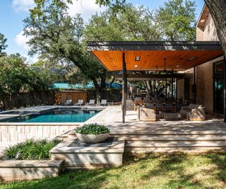 house exterior with canopy and pool