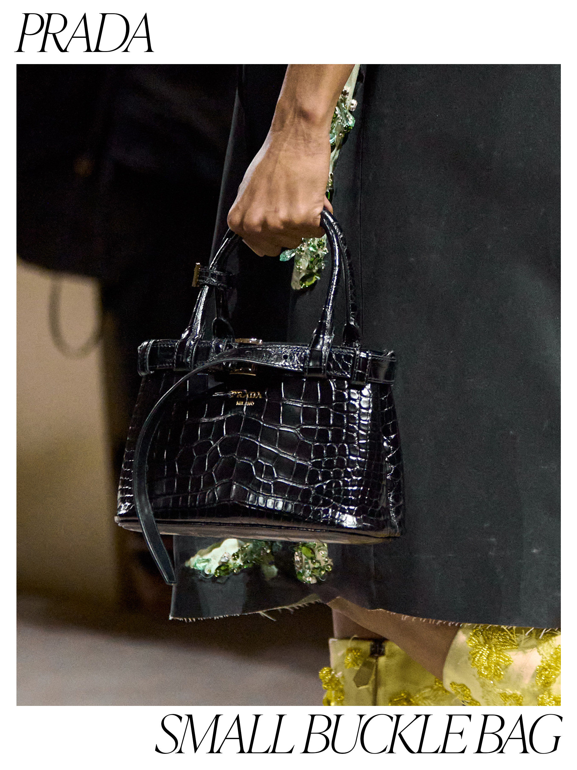 a detail image of a Prada mini buckle croc-effect handbag on the fall 2026 runway