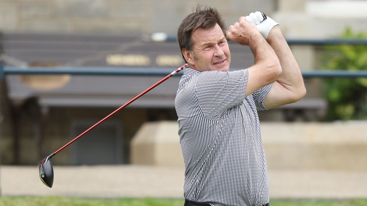 Sir Nick Faldo hits a drive