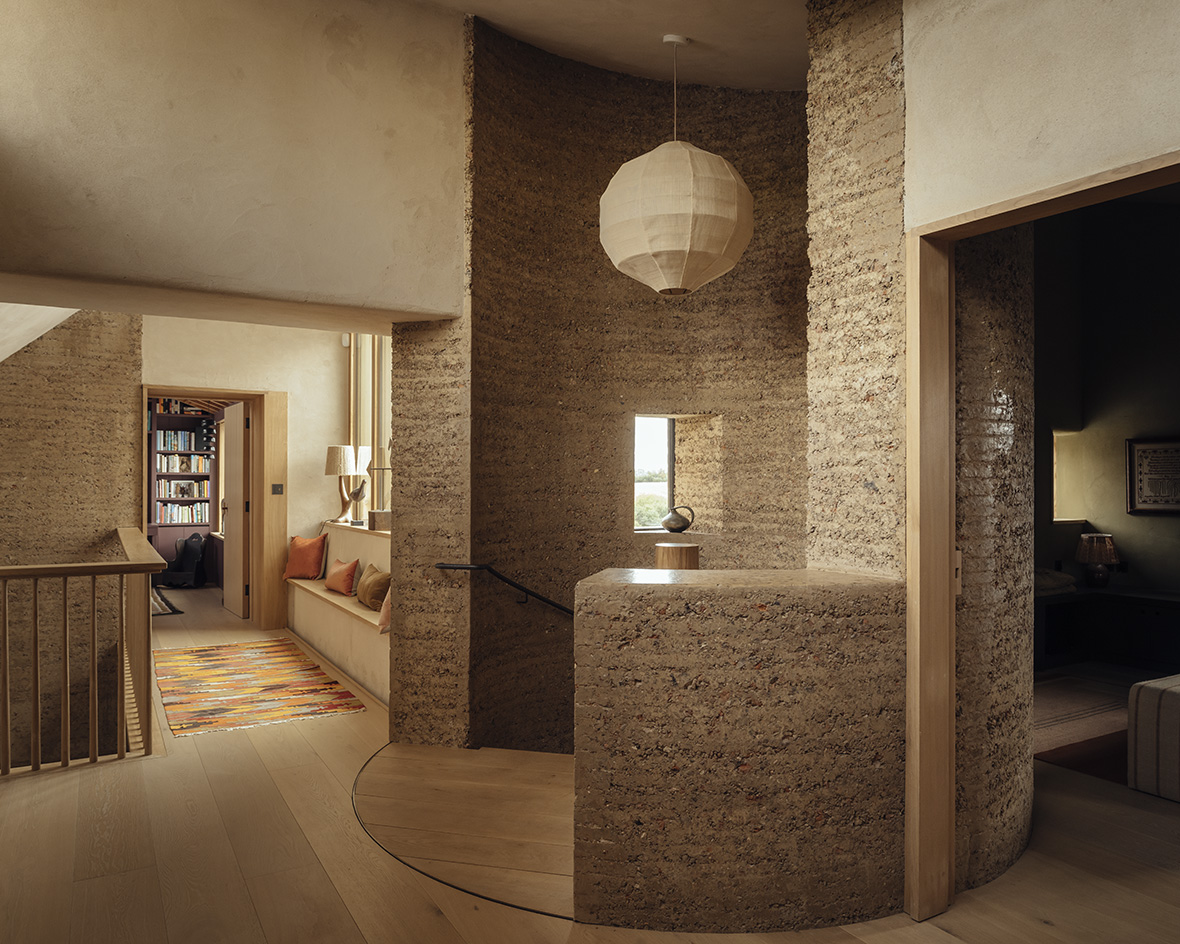 view of Rammed Earth House by Tuckey Design Studio with tactile walls and earth tones