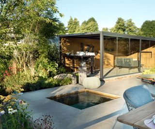 show garden with garden building and plunge pool by Consilium Hortus