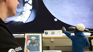 Shaun the Sheep checks out the craft that carried him to the moon and baa-ck.