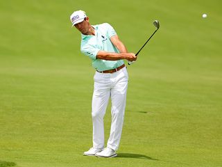 Billy Horschel hitting a wedge shot from the fairway