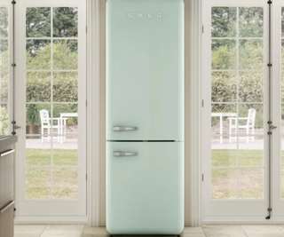 A Smeg fridge in a bright traditional kitchen
