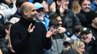 Manchester City manager Pep Guardiola applauds during the Premier League match between Manchester City and Liverpool at the Etihad Stadium on April 1, 2023 in Manchester, United Kingdom.