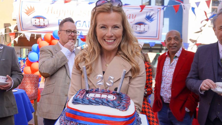 Bargain Hunt celebrates its 25th birthday with a cake held by Christina Trevanion