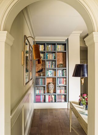 Bookcase styling in an entranceway