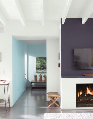 A living space with an analogous color palette of blue and purple