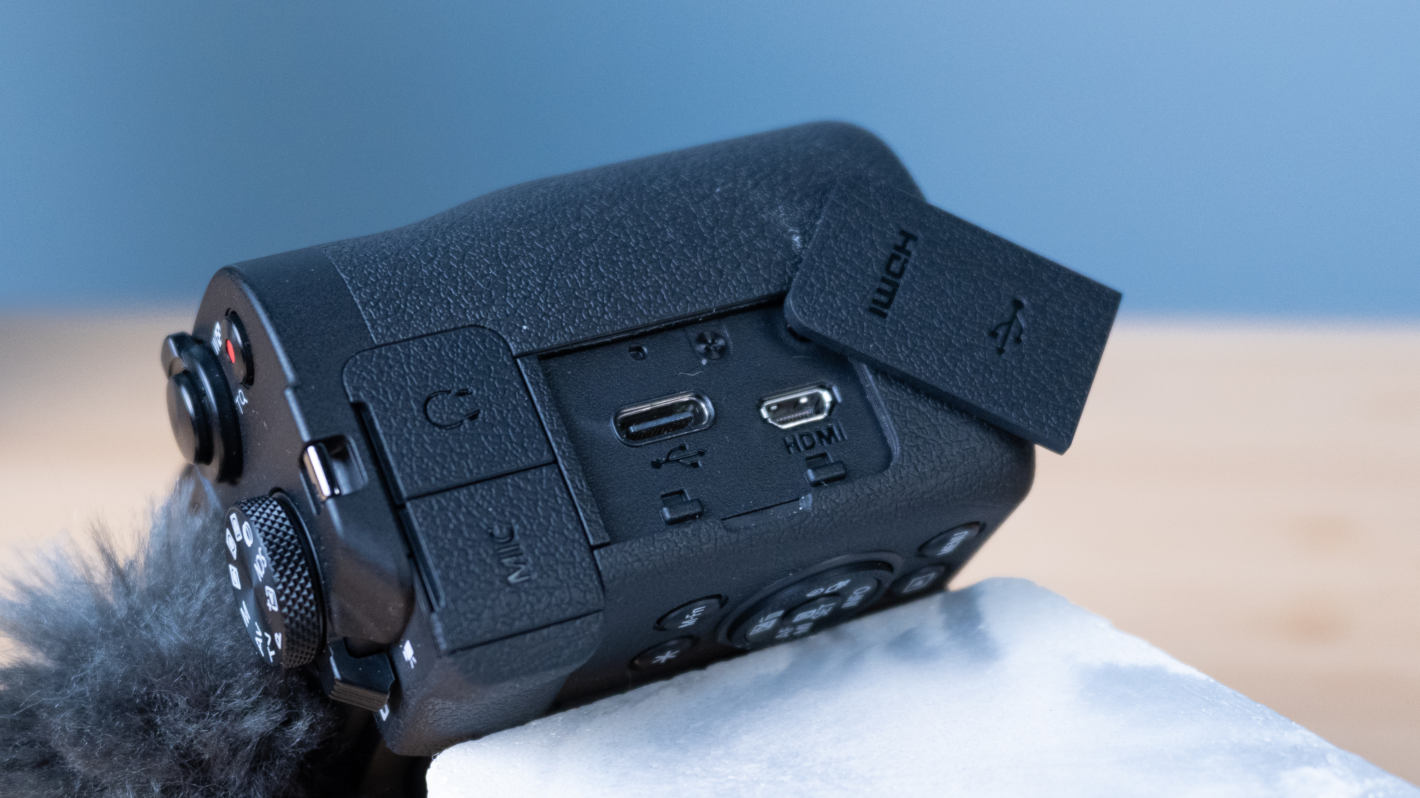 A black Canon PowerShot V1 compact vlogging camera