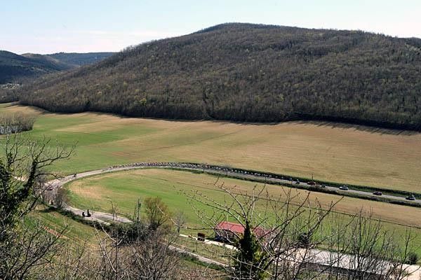 The peloton winds its way through the Italian country side.
