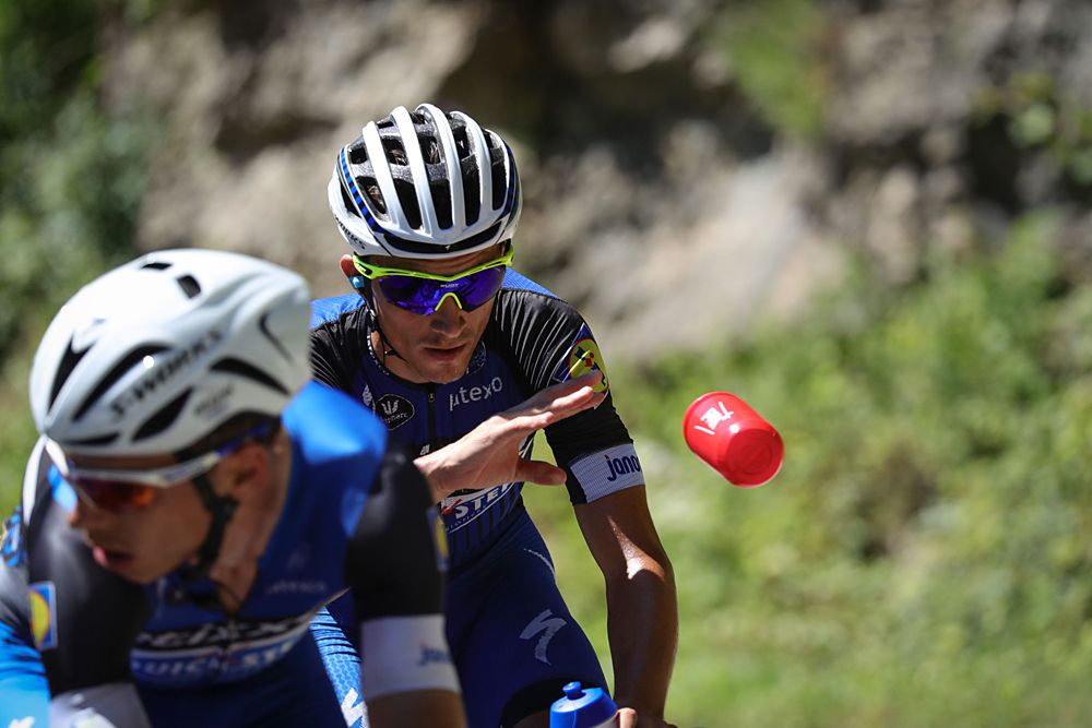 Julian Alaphilippe (Etixx-QuickStep) throws a water bottle stage 16 Tour de France
